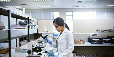 Shot of a young woman transferring liquid from a pipette to a test tube in a laboratory