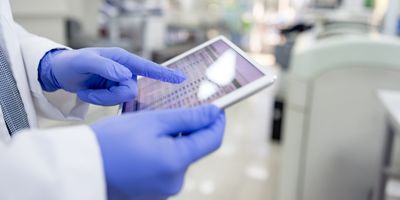 Scientist uses a tablet in the laboratory