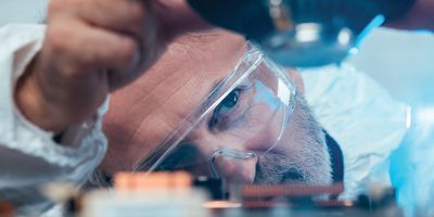 Technician troubleshoots a lab instrument