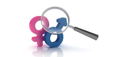 the symbol for male and female being examined by a magnifying glass on a white bachground