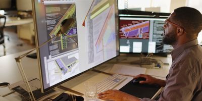 Person working on a computer designing new materials