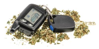 Car keys and cannabis on a white background