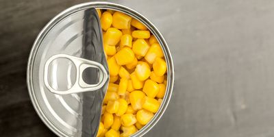 Top view of a can of corn being opened