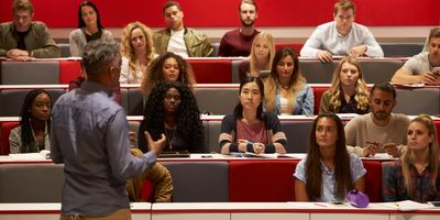 Professor teaching in a university classroom