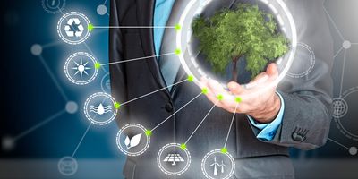 Man in a suit holding a hologram of a tree with various environmentalism symbols