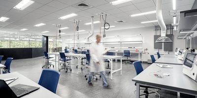 a scientist walking through a lab with a flexible design