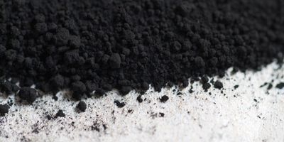 Black soot or powder on a white background