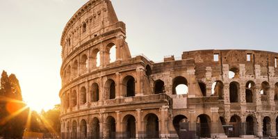 Roman coliseum ruins at sunset