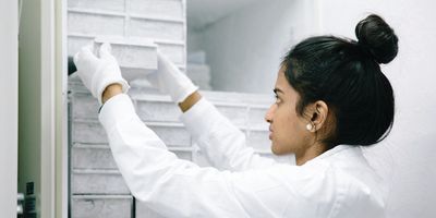 Scientist removes samples from a ULT freezer