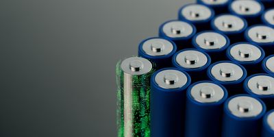 a single futuristic-looking battery with translucent casing covered in green glowing dots is at the front corner of a group of normal-looking blue batteries, all on a grey background