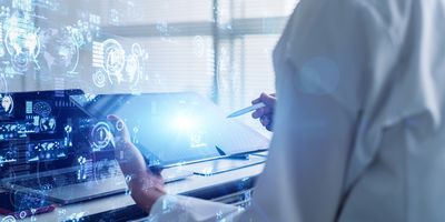 Scientist works on a tablet in the lab