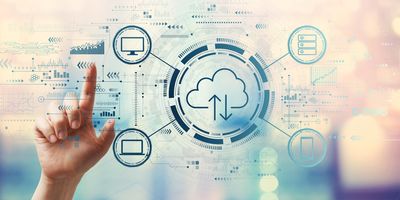 Cloud computing concept with hand pressing a button on a technology screen