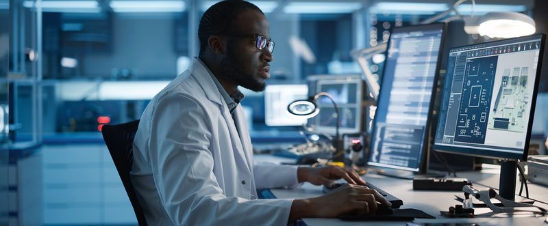 Male Engineer Works on Computer with CAD Programming Software. 