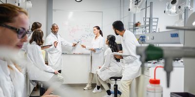 Group of scientists conducting a meeting in the lab