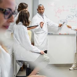 Group of scientists conducting a meeting in the lab