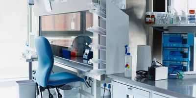 Blue Chair in front of a Fume Hood