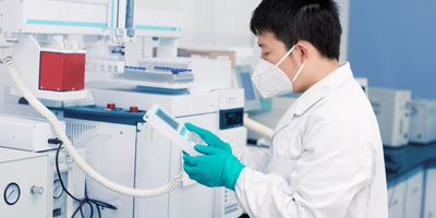 Senior male researcher carrying out scientific research in a lab