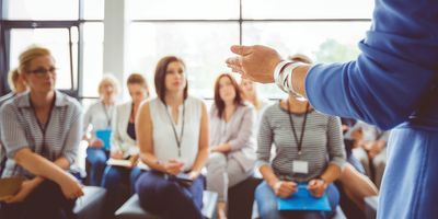 Leader addresses a group of trainees