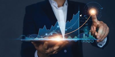 Man traces the upward trend of a bar chart with his finger