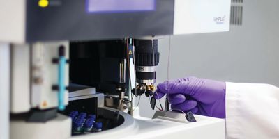 Scientist using an analytical instrument