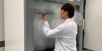 Scientist opens laboratory fume hood