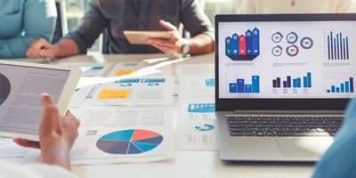 Lab managers examine KPIs and metrics sheets