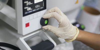 Scientist operates a rotary evaporator