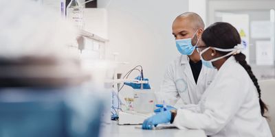 Shot of two young scientists conducting medical research in a laboratory.