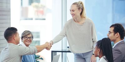 Lab manager shakes hand with a sales representative