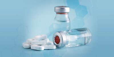 Pharmaceutical tablets and vials sitting on a counter