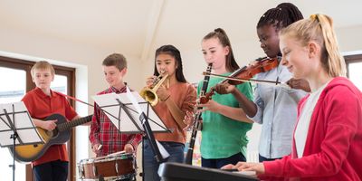 Students play instruments in a music class