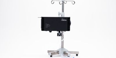 The MAVEN attached to a stand on a white background