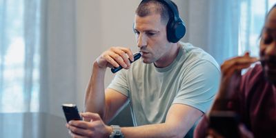 Man listening to music while smoking a vape