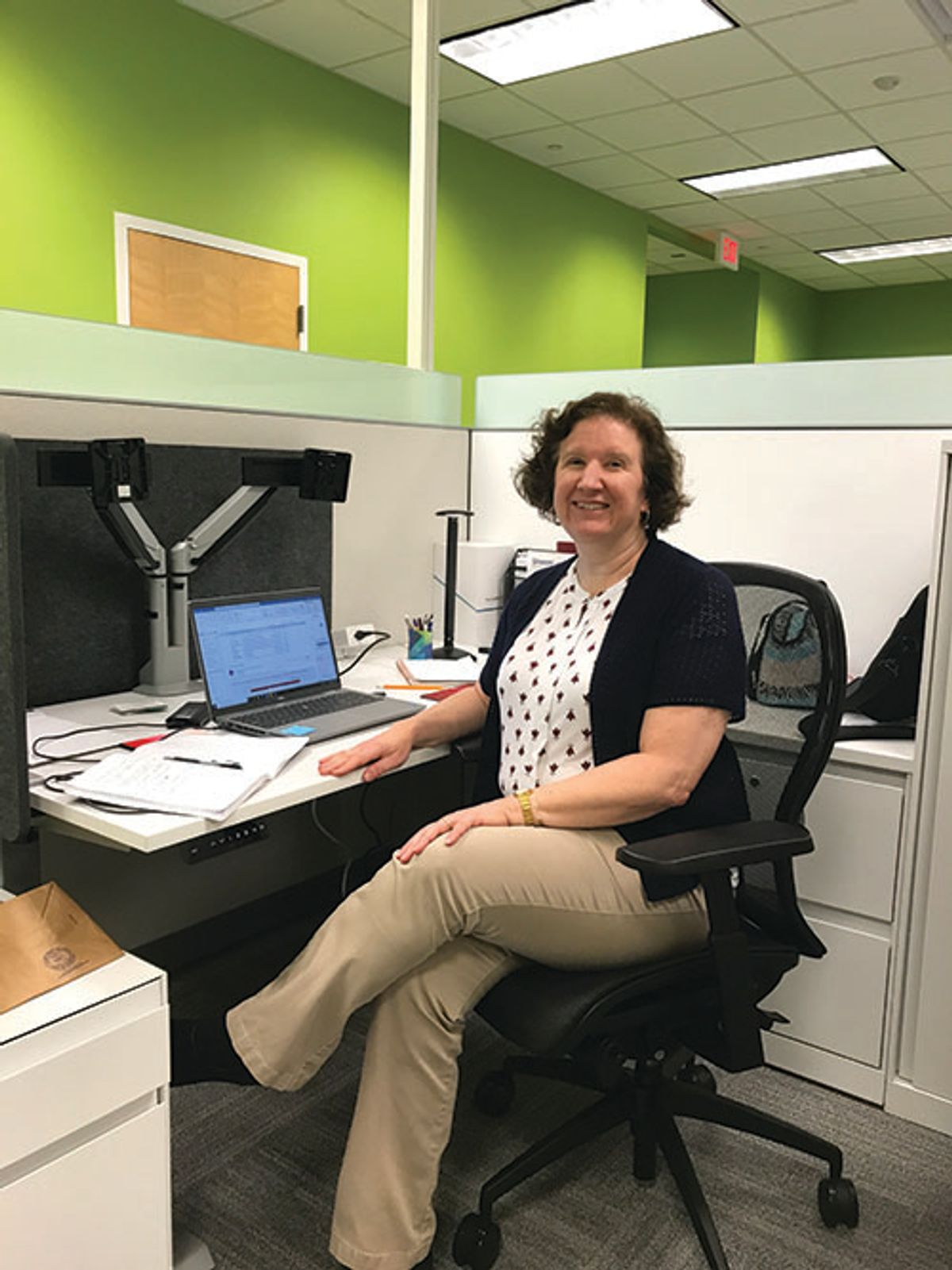 Photo of Stephanie Mabry, PhD, sitting at her desk.