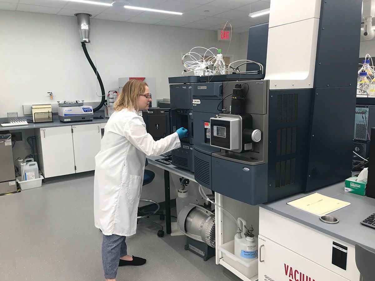 USP researcher uses a mass spectrometer