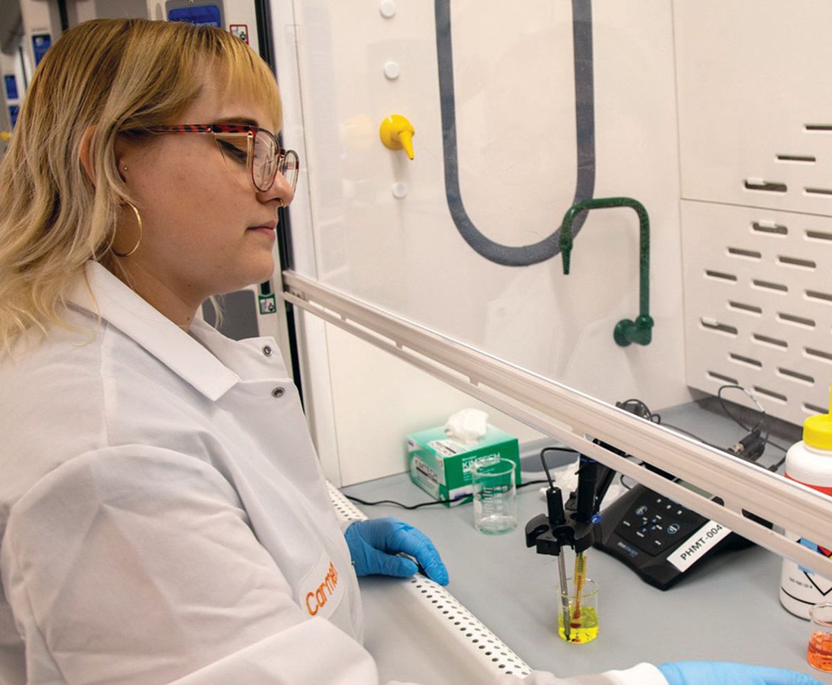 USP staff member work in a fume hood.