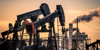 image showing oil well at sunset