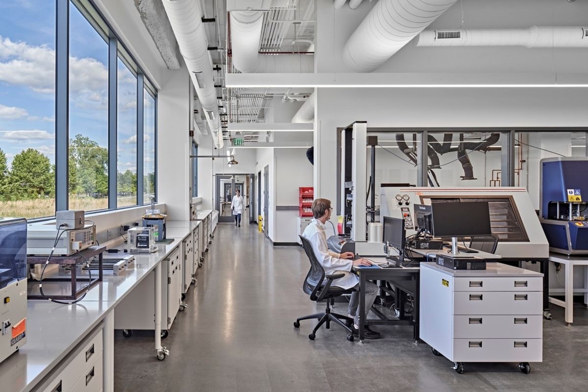 Image of a spacious lab with windows along one wall