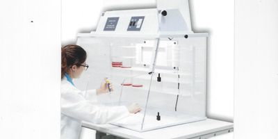 Researcher working at the new Plas-Labs PCR machine