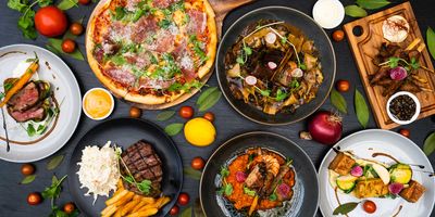 An assortment of different delicious cooked foods on a table