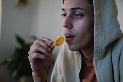 Man eats a potato chip