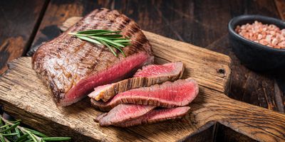 Beautifully cooked steak sliced on a cutting board