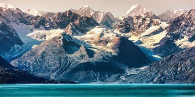 A mountain range beside a lake