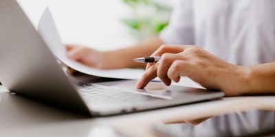 Person typing on a laptop