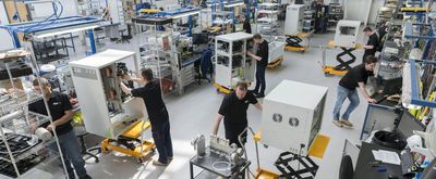 Group of PEAK employees working on different gas generator units