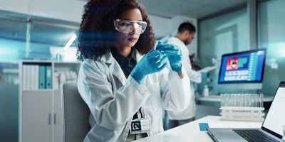 Woman researcher looking at a sample in the lab