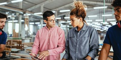 Workers discuss a problem in a meeting