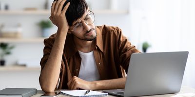 Stressed student working at a computer