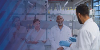 Four scientists having a meeting in the lab