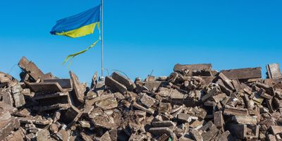 Damaged Ukraine Flag on a pile of rubble